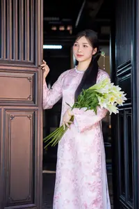 Graceful Asian Lady in Pink Ao Dai with Pristine White Lilies in Traditional Setting - image 2