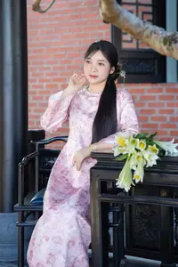Graceful Asian Lady in Pink Ao Dai with Pristine White Lilies in Traditional Setting - image 7