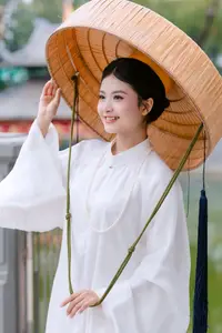 Graceful Vietnamese Beauty: A Serene Woman in White with a Lily - image 5