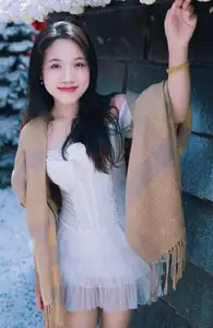 Radiant Beauty: Girl in Pristine White Dress Amidst Romantic Winter Wonderland 1000024890 - image 0