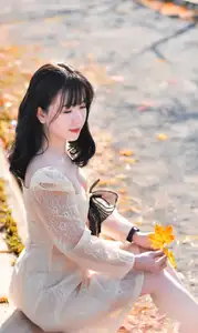 Serene Autumn Girl Portrait Captivating Beauty Amidst Golden Leaves - image 0
