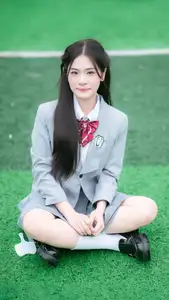 Cute Schoolgirl Frames a Moment on Green Grass - image 10