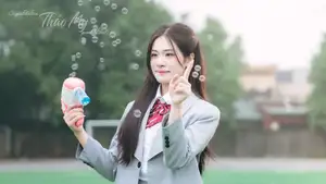 Cute Schoolgirl Frames a Moment on Green Grass - image 3