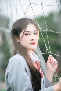 Cute Schoolgirl Frames a Moment on Green Grass - image 5