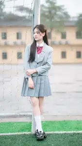 Cute Schoolgirl Frames a Moment on Green Grass - image 6
