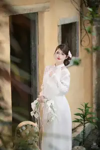 Elegant Asian Beauty: A Gentle Girl Adorned with a Pure White Orchid - image 12