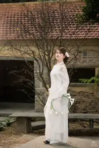 Elegant Asian Beauty: A Gentle Girl Adorned with a Pure White Orchid - image 10