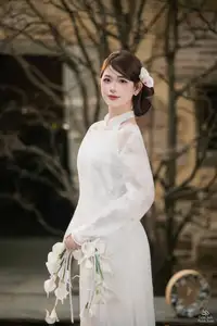 Elegant Asian Beauty: A Gentle Girl Adorned with a Pure White Orchid - image 6