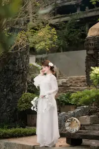 Elegant Asian Beauty: A Gentle Girl Adorned with a Pure White Orchid - image 4