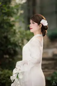 Elegant Asian Beauty: A Gentle Girl Adorned with a Pure White Orchid - image 11