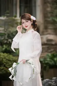 Elegant Asian Beauty: A Gentle Girl Adorned with a Pure White Orchid - image 9