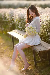 Gentle Muse in White Daisy Field: Youthful Beauty Captivating Hearts Under Golden Hour Sun - image 11