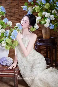 Ethereal Vietnamese Beauty: Graceful Asian Girl in Modern Yếm with Delicate Blooms. - image 5