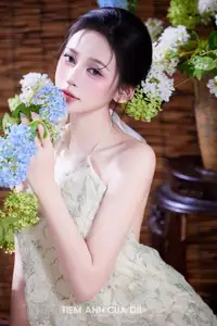Ethereal Vietnamese Beauty: Graceful Asian Girl in Modern Yếm with Delicate Blooms. - image 9