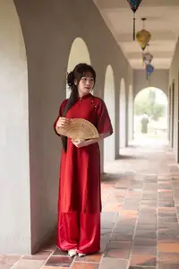 Discover the Timeless Elegance of a Vietnamese Woman in Red Ao Dai at Ancient Architecture. - image 5