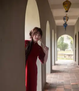 Discover the Timeless Elegance of a Vietnamese Woman in Red Ao Dai at Ancient Architecture. - image 2