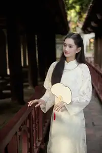 Graceful Vietnamese Woman in Ao Dai Amidst Ancient Architecture - image 5