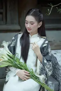 Graceful Vietnamese Woman in Ao Dai Amidst Ancient Architecture - image 9