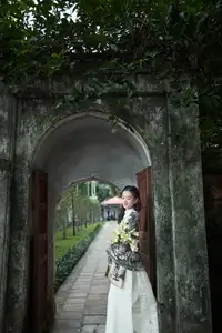 Graceful Vietnamese Woman in Ao Dai Amidst Ancient Architecture - image 6