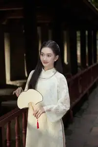 Graceful Vietnamese Woman in Ao Dai Amidst Ancient Architecture - image 4