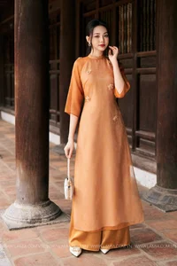Timeless Grace: Amber Ao Dai in Ancient Architecture - image 1