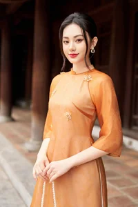 Timeless Grace: Amber Ao Dai in Ancient Architecture - image 3