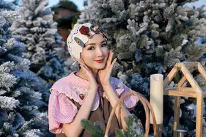 Giang My: Ageless U55 Beauty Shines Bright Celebrating Christmas Amidst Snowy Scenery - image 2