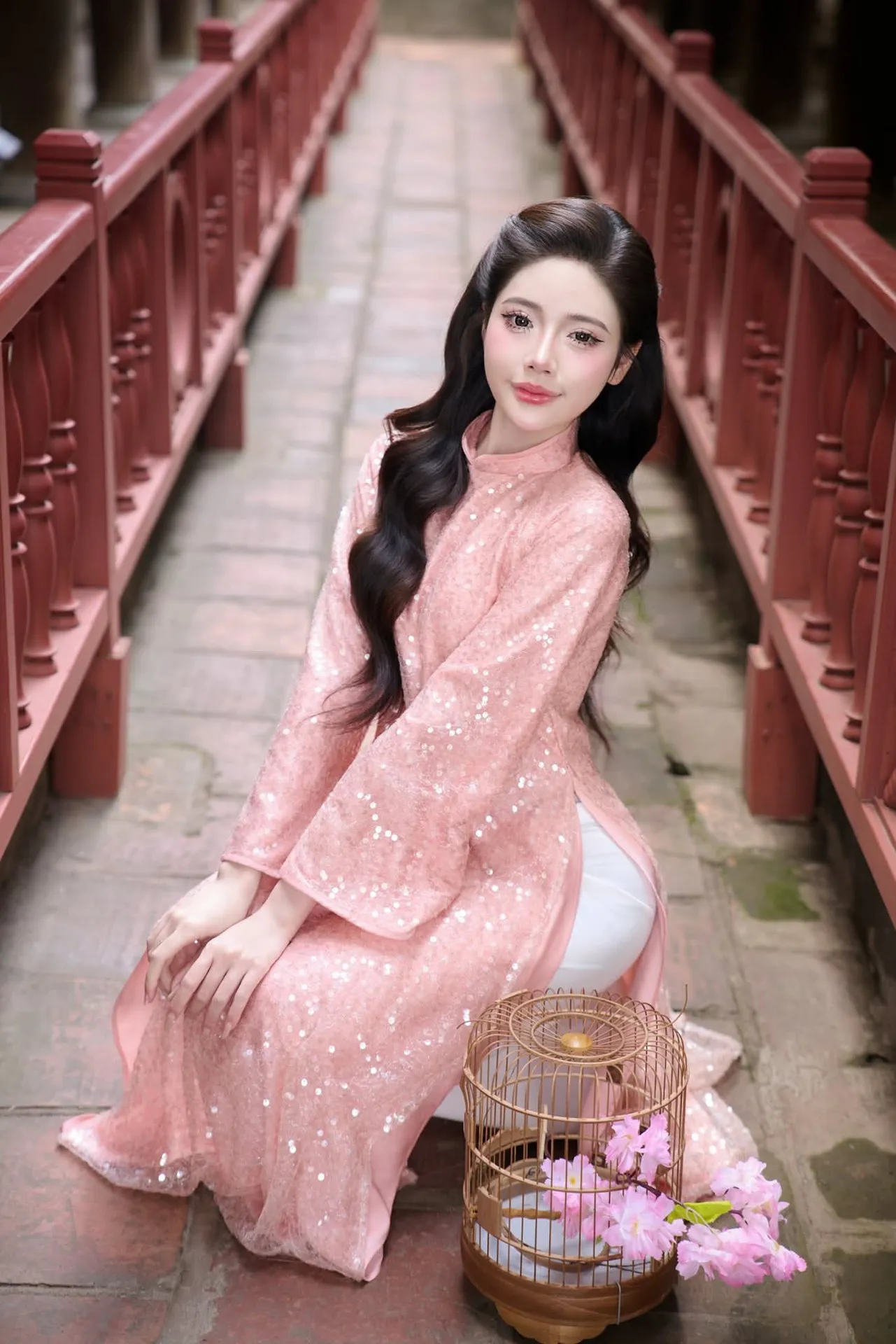 Discover Asian Beauty: Elegant Girl in Dreamy Pink Ao Dai Portrait