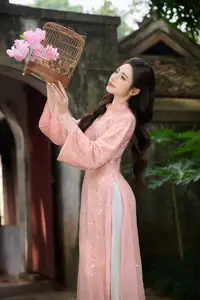 Discover Asian Beauty: Elegant Girl in Dreamy Pink Ao Dai Portrait - image 15