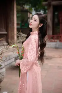 Discover Asian Beauty: Elegant Girl in Dreamy Pink Ao Dai Portrait - image 4