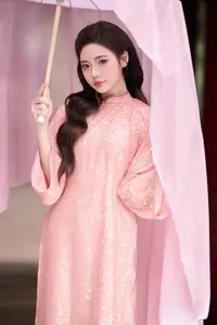 Discover Asian Beauty: Elegant Girl in Dreamy Pink Ao Dai Portrait - image 13