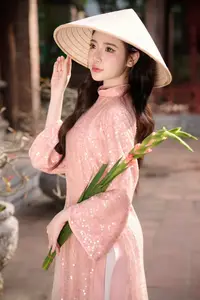 Discover Asian Beauty: Elegant Girl in Dreamy Pink Ao Dai Portrait - image 5
