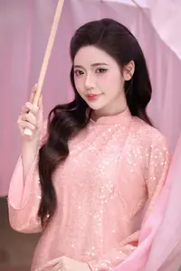 Discover Asian Beauty: Elegant Girl in Dreamy Pink Ao Dai Portrait - image 9