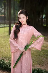 Discover Asian Beauty: Elegant Girl in Dreamy Pink Ao Dai Portrait - image 10