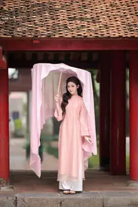 Discover Asian Beauty: Elegant Girl in Dreamy Pink Ao Dai Portrait - image 17