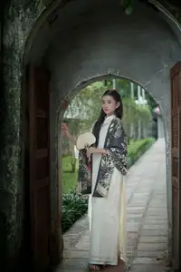 Graceful East Asian Beauty: Woman in Traditional Attire, Elegant with a Paper Fan. - image 7