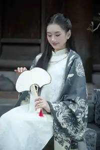Graceful East Asian Beauty: Woman in Traditional Attire, Elegant with a Paper Fan. - image 5