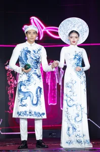 Luong The Thanh and Thuy Diem Exude Elegance in Dragon and Phoenix Ao Dai - image 1