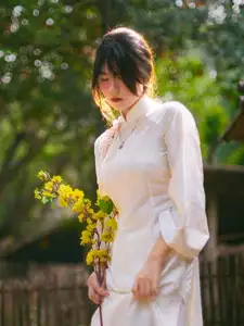 Graceful Asian Beauty: A Vietnamese Woman in Traditional Attire, Evoking Timeless - image 4