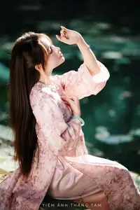 Vietnamese Charm: Elegant Beauty in Pink Traditional Attire - image 15