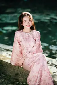 Vietnamese Charm: Elegant Beauty in Pink Traditional Attire - image 2