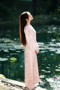Vietnamese Charm: Elegant Beauty in Pink Traditional Attire - image 4