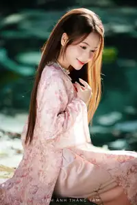 Vietnamese Charm: Elegant Beauty in Pink Traditional Attire - image 8