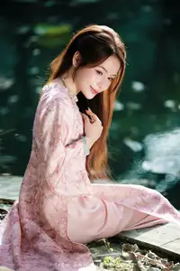 Vietnamese Charm: Elegant Beauty in Pink Traditional Attire - image 3