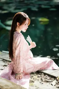 Vietnamese Charm: Elegant Beauty in Pink Traditional Attire - image 14