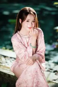 Vietnamese Charm: Elegant Beauty in Pink Traditional Attire - image 6
