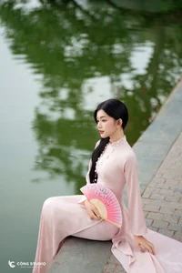 Graceful Muse in Traditional Pink Ao Dai - image 7