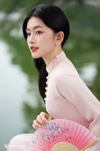 Graceful Muse in Traditional Pink Ao Dai - image 5
