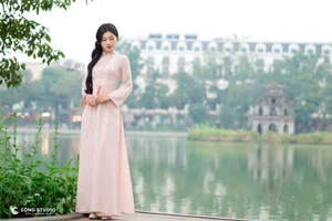 Graceful Muse in Traditional Pink Ao Dai - image 4