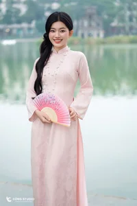 Graceful Muse in Traditional Pink Ao Dai - image 3